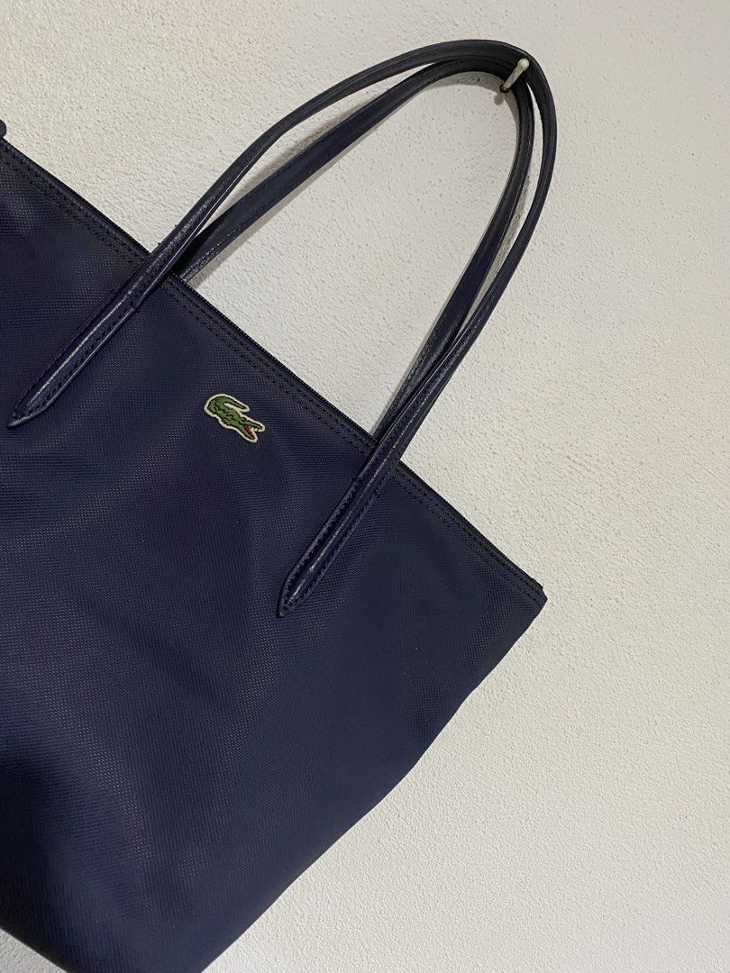 Lacoste Tote Bag (Category: Tote Bags) located in Goa. Submitted by dandd_thrift_goods (Listing ID 1464659455, Image 2). Description: ▪️Issue: May kaunting tangal na leather sa strap (Not visible) plus need wash.