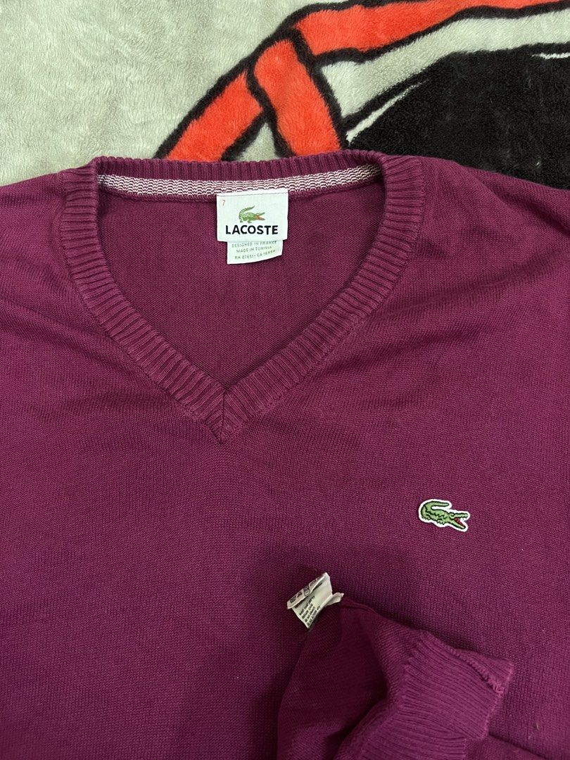 Lacoste V-Neck Long Sleeve Sweater (Category: Longsleeves) located in Tanza. Submitted by 1954_street (Listing ID 1464579676, Image 2). Description: LACOSTE sz 7 25x28 excellent condition m- Authentic Lacoste purple V-neck sweater - Soft and comfortable knit material - Classic embroidered crocodile logo on chest - Long sleeves with ribbed cuffs and hem - Perfect for layering or standalone wear.