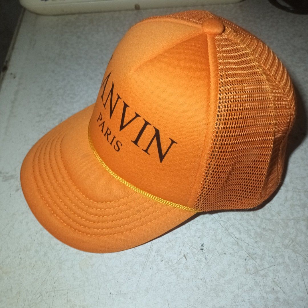 Lanvin Paris Orange Trucker Cap (Category: Caps & Hats) located in Manila. Submitted by itsnik444 (Listing ID 1464585984, Image 2). Description: Mode of Payments: •GCASH Courier: • LALAMOVE ( Same day Delivery) • J&T EXPRESS • LBC ❗️ Product color may slightly vary due to photographic ❗️ DISCLAIMER: We are not associated or affiliated with any brand posted.