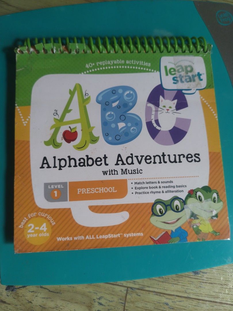 LeapFrog LeapStart with Alphabet adventures book (Category: Educational & Learning Toys) located in Caloocan City. Submitted by carmelasfashiongallery (Listing ID 1464666938, Image 2). Description: - LeapStart Alphabet Adventures with Music book - Level 1: Preschoolers aged 2-4 years - Over 40 replayable activities - Teaches matching letters and sounds - Encourages exploring books - Practices rhyme and alliteration - Compatible with all LeapStart