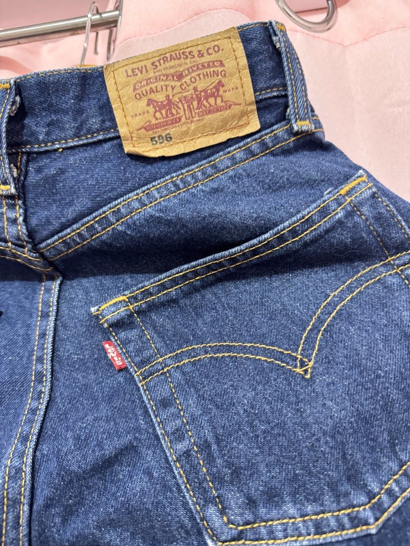 Levi's 596 Dark Wash Jeans (Category: Jeans) located in Bulacan. Submitted by gandarascloset (Listing ID 1464584407, Image 3). Description: - Classic Levi's 596 jeans - Dark wash denim - Iconic red tab and leather patch - Yellow stitching details - Button fly closure - Versatile staple piece.