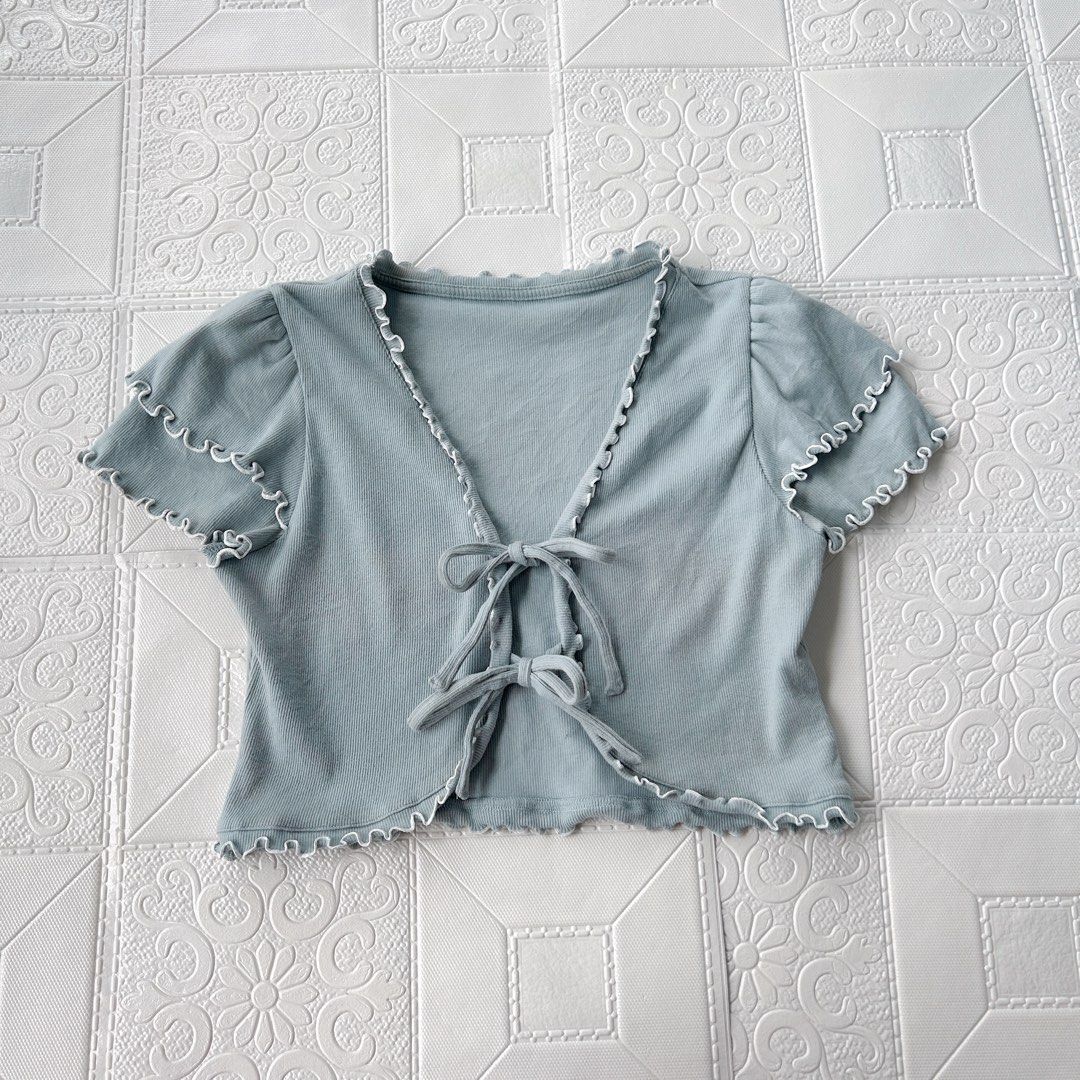 Light Blue Ribbed Tie Front Top/cover up (Category: Coats, Jackets and Outerwear) located in Baguio. Submitted by icandy.collects (Listing ID 1464573388, Image 1). Description: Light blue cropped ribbon top -cover up -stretchable s-l (freesize) flaw: minimal bleach stain in sleeves.