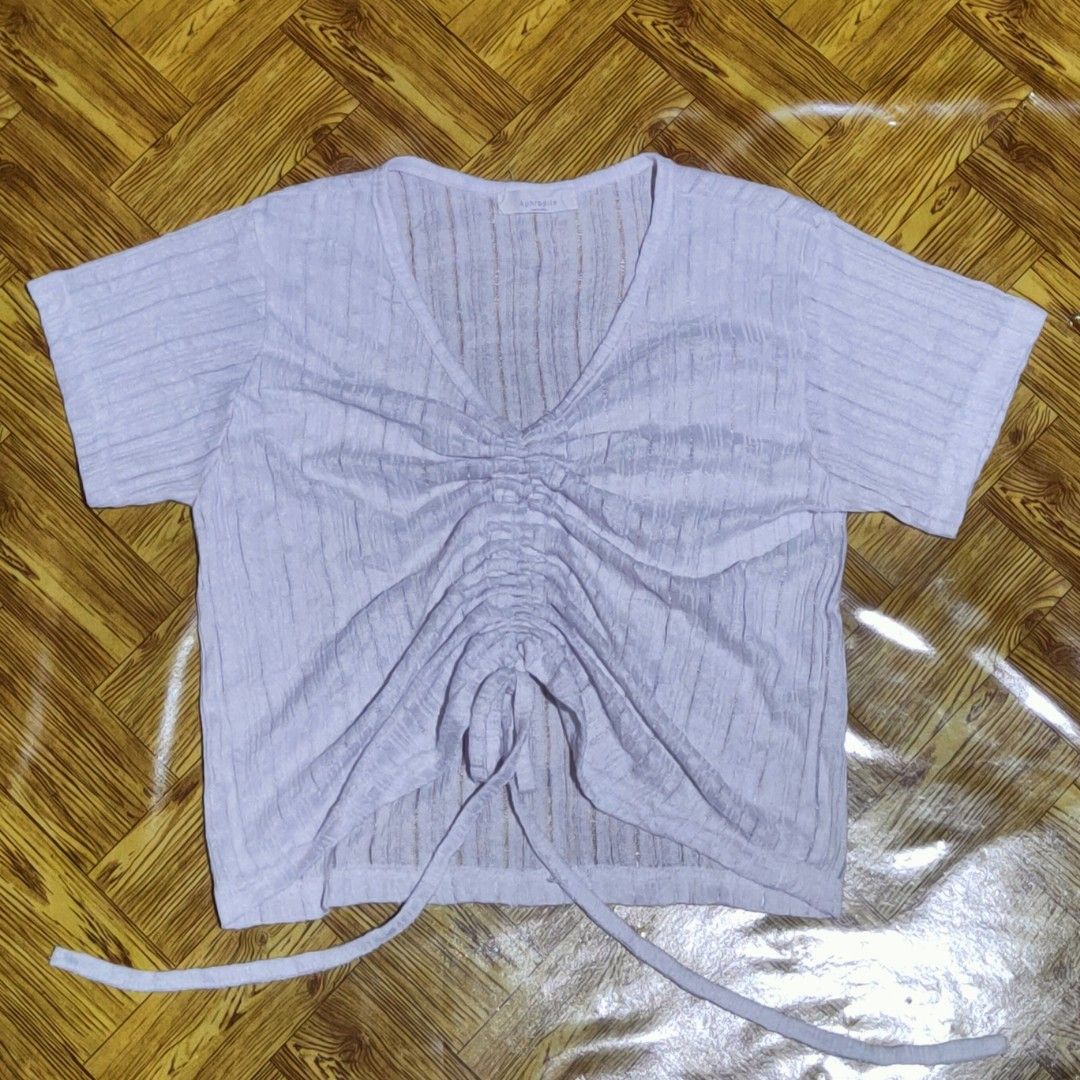White Ribbed Ruched V-Neck Crop Top (Category: Blouses) located in Cagayan de Oro. Submitted by royalriver_549ef2 (Listing ID 1464597882, Image 2). Description: - Thrifted - L17/W15 - Cute White crop top - Ribbed texture - Ruched detail with drawstring in the front - V-neckline - Short sleeves - Easy to style with high-waisted jeans or skirts.