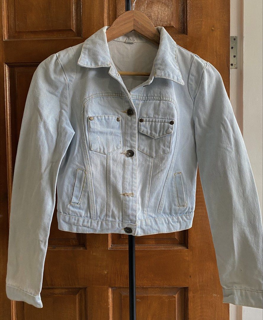 Light Wash Denim Jacket (Category: Coats, Jackets and Outerwear) located in Legazpi City. Submitted by engr.i (Listing ID 1464585062, Image 1). Description: - Fits S-M - Classic light wash denim jacket - Button-up front closure - Two chest pockets - Two side pockets - Standard shirt collar - Versatile for layering over tees or dresses.