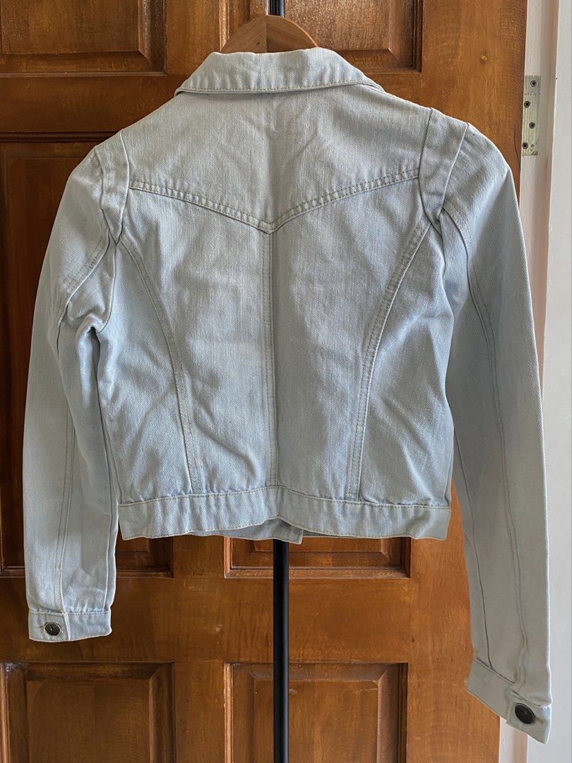 Light Wash Denim Jacket (Category: Coats, Jackets and Outerwear) located in Legazpi City. Submitted by engr.i (Listing ID 1464585062, Image 2). Description: - Fits S-M - Classic light wash denim jacket - Button-up front closure - Two chest pockets - Two side pockets - Standard shirt collar - Versatile for layering over tees or dresses.