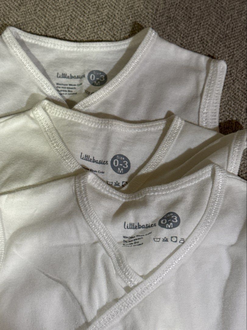 Little Basics Baby Vests (0-3 Months) - White (Category: Babies & Kids Fashion) located in Cebu City. Submitted by jillianmariebascones (Listing ID 1464691996, Image 3). Description: - Set of 3 white baby vests - Brand: Little Basics - Size: 0-3 months - Sleeveless design - Easy snap button closure - Made of soft, breathable cotton - Ideal for everyday wear.