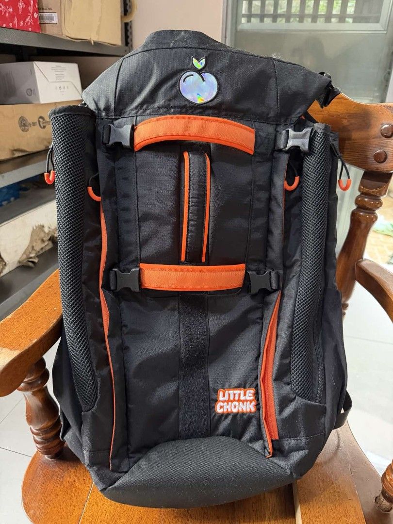 Little Chonk Black Orange Backpack (Category: Homes & Other Pet Accessories) located in Quezon City. Submitted by chewy.seller (Listing ID 1464655279, Image 1). Description: - Stylish black backpack with a vibrant orange interior and accents. - "Little Chonk" logo prominently displayed on the front. - Multiple pockets and straps for versatile gear organization and carrying. - Padded straps and back panel ensure maximum comfort during wear. - Perf
