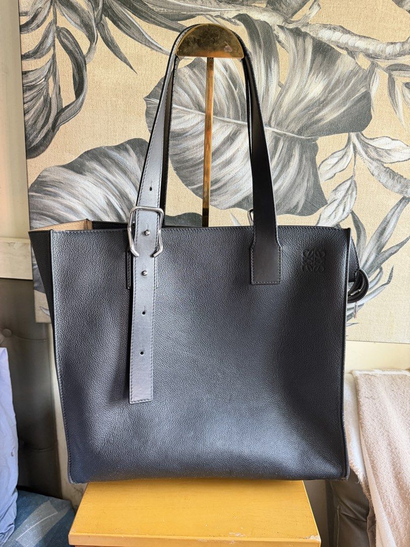 Loewe Black Leather Tote Bag (Category: Briefcases) located in Quezon City. Submitted by good_finds_mnl (Listing ID 1464625819, Image 1). Description: Authentic Loewe black leather tote bag with embossed Anagram logo. Features a zip closure, interior zip pocket, and is made in Spain. Classic and versatile. Detailed photos upon request Low-ballers will not be entertained. .