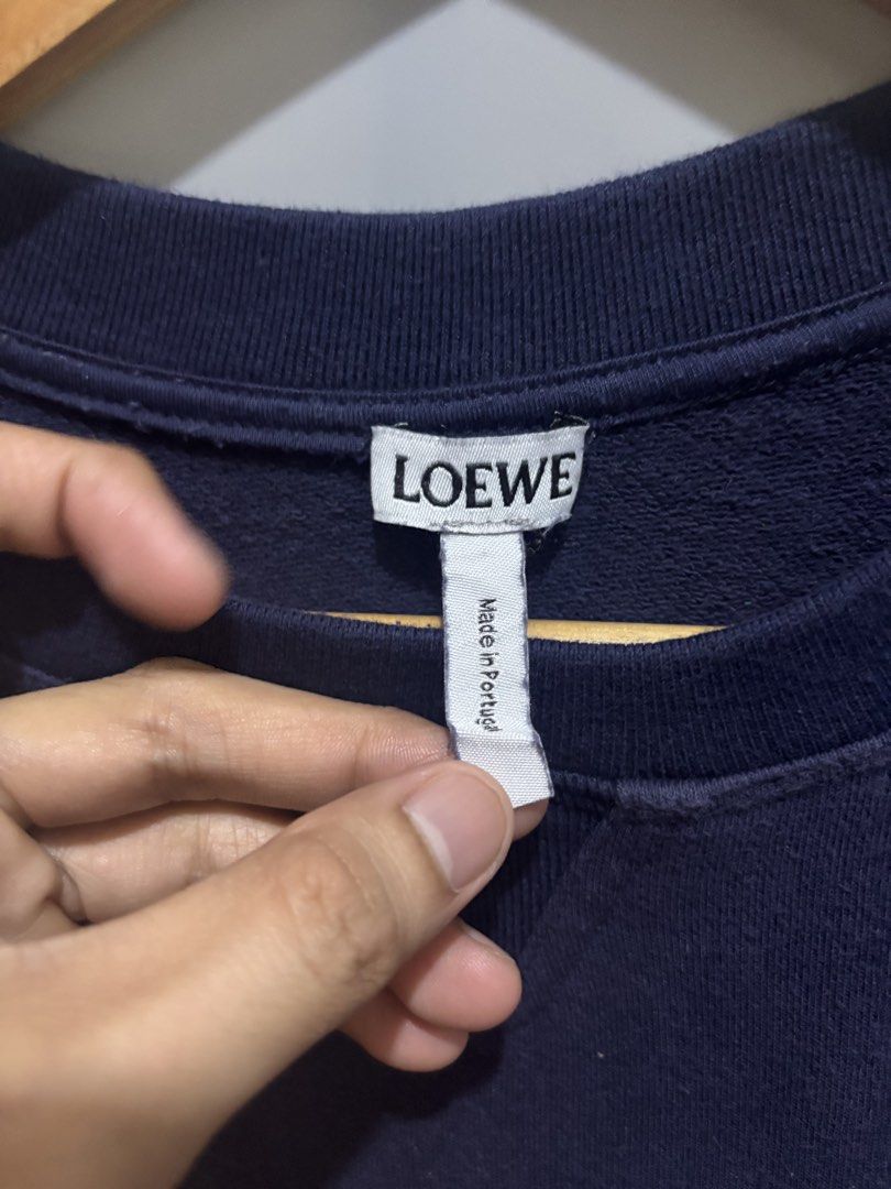 LOEWE DUMBO SWEATSHIRT (Category: Coats, Jackets and Outerwear) located in Bayambang. Submitted by lo_keythrifting (Listing ID 1464599880, Image 3). Description: - Navy blue Loewe sweatshirt - Condition: Good as new - Dimes: 22.5*27 - Color rate: 10/10 - No issue - Features a Dumbo graphic on the front - Loewe logo printed on the back - Made in Portugal - Ideal for fans of Disney and Loewe MOP: GCASH COURIER: J&T.