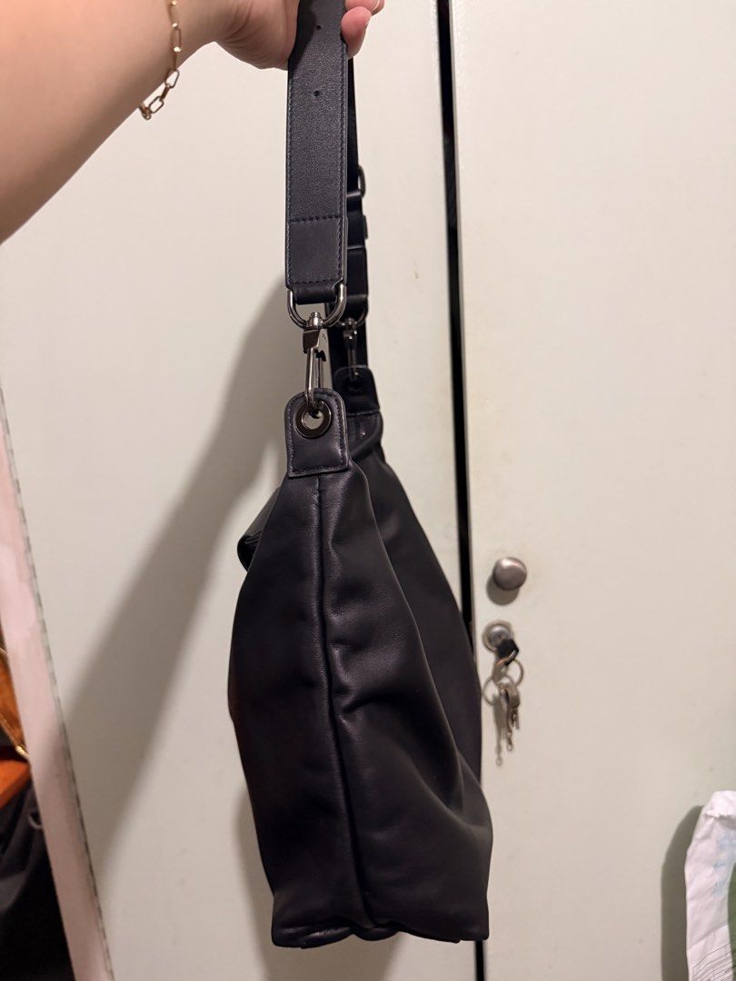 Longchamp Black Leather Shoulder Bag (Category: Luxury Bags & Wallets) located in San Juan City. Submitted by zenrabbit.6105c7 (Listing ID 1464691358, Image 3). Description: - Brand: Longchamp - Color: Classic black - Material: Soft leather with dark metal hardware - Closure: Front flap with snap button and main zip compartment - Strap: Adjustable with side ring attachments - Details: Embossed logo on front flap, clean interior lining - Style: Sl