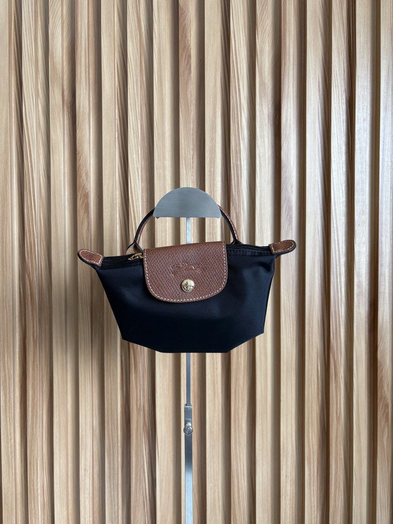 LONGCHAMP LE PLIAGE POUCH IN NOIR (Category: Purses & Pouches) located in Imus. Submitted by dumpitlikeaqueen (Listing ID 1464713677, Image 1). Description: • Store-bought at Longchamp, Duty Free Fiestamall • With care card, zip plastic & paper bag • 3 pcs. on hand • Open for layaway • Instagram Shop: @dumpitlikeaqueen.