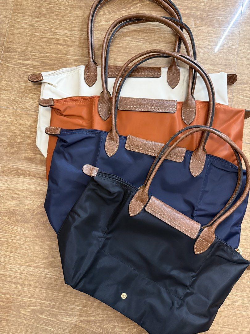 Longchamp Le Pliage Shoulder Bags Multiple Colors (Category: Tote Bags) located in Manila. Submitted by absndy (Listing ID 1464736901, Image 2). Description: For sale: Longchamp Large and Medium Long handle in Brigue, Papier, Noir, and Marine.