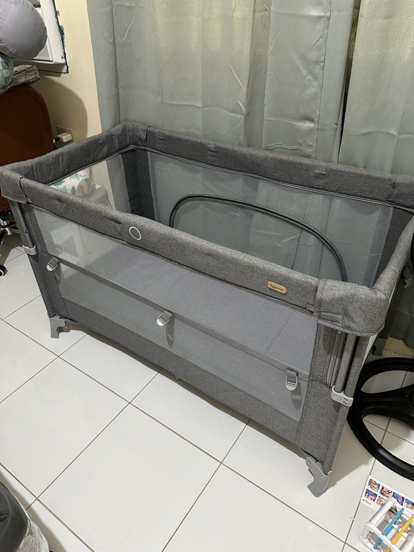 Looping All in one pack and play (Category: Cots & Cribs) located in Manila. Submitted by whatwewore18 (Listing ID 1464764497, Image 2). Description: - Brand: Looping - Color: Elegant Grey -Used for like 3 mos only - Function: Baby cot and playpen in one -Co-sleep - Safety & Comfort: Breathable mesh sides for great airflow and easy monitoring - Frame: Sturdy and durable metal internal frame - Portability: Includes a matching grey storage bag with