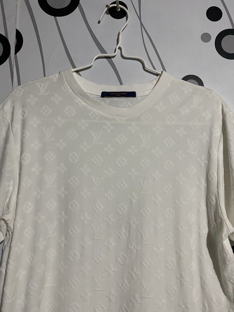 Louis Vuitton Embossed Monogram T-shirt (Category: Tshirts & Polo Shirts ) located in Cebu City. Submitted by patspickph (Listing ID 1464615930, Image 3). Description: This is a white Louis Vuitton Embossed Monogram T-shirt featuring an all-over tonal embossed or hook-and-loop monogram pattern. Dimensions is width 19 and Length 26. Excellent Condition👌.