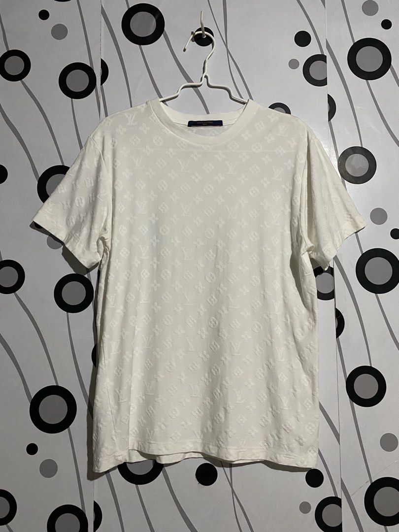 Louis Vuitton Embossed Monogram T-shirt (Category: Tshirts & Polo Shirts ) located in Cebu City. Submitted by patspickph (Listing ID 1464615930, Image 1). Description: This is a white Louis Vuitton Embossed Monogram T-shirt featuring an all-over tonal embossed or hook-and-loop monogram pattern. Dimensions is width 19 and Length 26. Excellent Condition👌.
