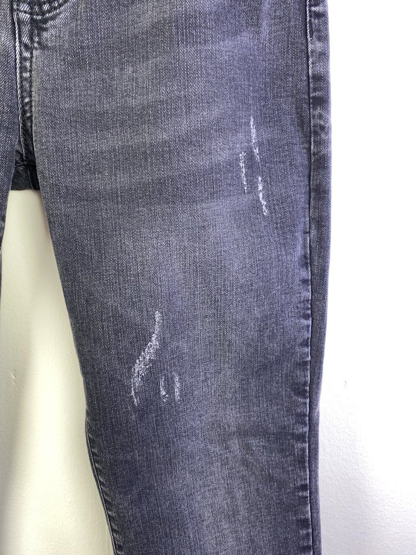 Louis Vuitton Grey Distressed Denim Jeans (Category: Jeans) located in Manila. Submitted by declutterpromax (Listing ID 1464601142, Image 3). Description: - Louis Vuitton Grey Denim Jeans - Distressed design with rips and fading - Unique LV charm detail on pocket - Slim fit for a modern silhouette - Ideal for stylish casual wear.