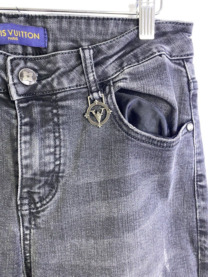 Louis Vuitton Grey Distressed Denim Jeans (Category: Jeans) located in Manila. Submitted by declutterpromax (Listing ID 1464601142, Image 2). Description: - Louis Vuitton Grey Denim Jeans - Distressed design with rips and fading - Unique LV charm detail on pocket - Slim fit for a modern silhouette - Ideal for stylish casual wear.