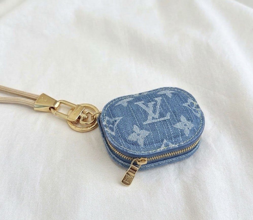 Louis Vuitton Monogram Denim & Leather Airpods Case (Category: Luxury Bags & Wallets) located in Mabalacat. Submitted by davidbianc04942 (Listing ID 1464597128, Image 1). Description: - Iconic LV monogram pattern - Available in denim blue, hot pink, and light pink leather - Features a gold clasp and lanyard - Keeps your Airpods safe and stylish.