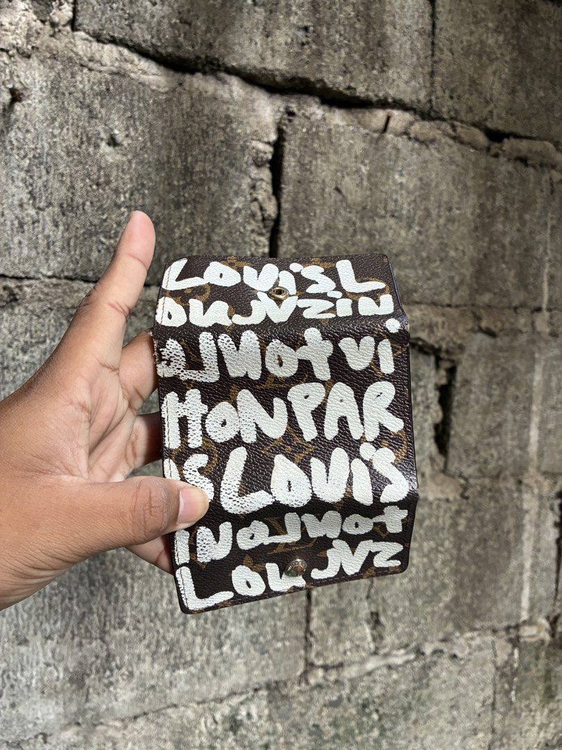 Louis Vuitton Monogram Graffiti Key Holder (Category: Luxury Bags & Wallets) located in Manila. Submitted by assortedgoodsv3 (Listing ID 1464764724, Image 1). Description: - Authentic Louis Vuitton key holder - Iconic brown monogram canvas with Stephen Sprouse white graffiti print - Features 6 interior key hooks with gold-tone hardware and snap button closure - Made in France - Condition: Exterior canvas and original paint are intact; interior sh