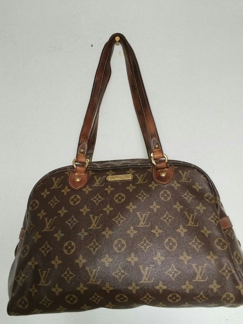 Louis Vuitton Monogram Shoulder Bag (Category: Shoulder Bags) located in Manila. Submitted by bagelyascollection (Listing ID 1464603465, Image 1). Description: - Classic Louis Vuitton monogram shoulder bag - Leather trim and straps show some wear - Zipper works smoothly - Interior lining is intact - Timeless piece for your collection - Date code visible in photos.