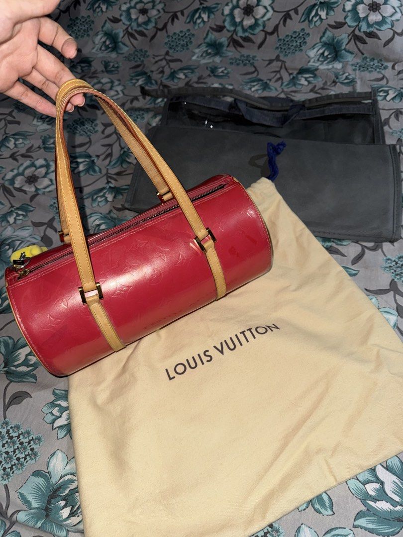 Louis Vuitton Monogram Vernis Papillon NEGOTIABLE (Category: Luxury Bags & Wallets) located in Makati City. Submitted by bcloset2 (Listing ID 1464748540, Image 3). Description: - Brand: Louis Vuitton - Model: Papillon - Material: Pink Monogram Vernis Leather with Vachetta Trim - Shape: Cylindrical with structured handles - Closure: Top zip closure - Interior: Spacious pink lining with exterior side pocket - Inclusions: Original beige Louis Vuitto