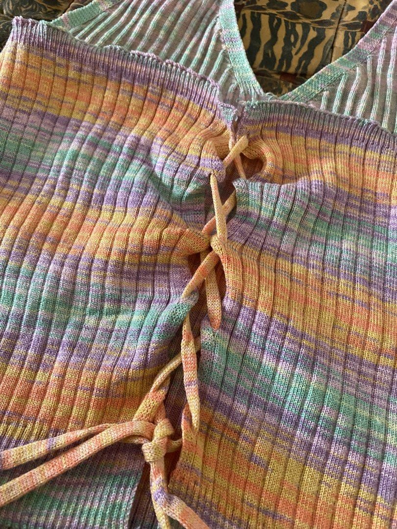 Lovito One Size Ribbed Halter Neck Tie Front Top (Category: Sleeveless) located in Manila. Submitted by angelinem022726 (Listing ID 1464607303, Image 2). Description: - Super cute ribbed halter neck top from Lovito - Features a stylish tie-front detail - Adorable rainbow stripe pattern - Versatile: pairs well with jeans or shorts - One size fits most - Ideal for summer days or nights out.