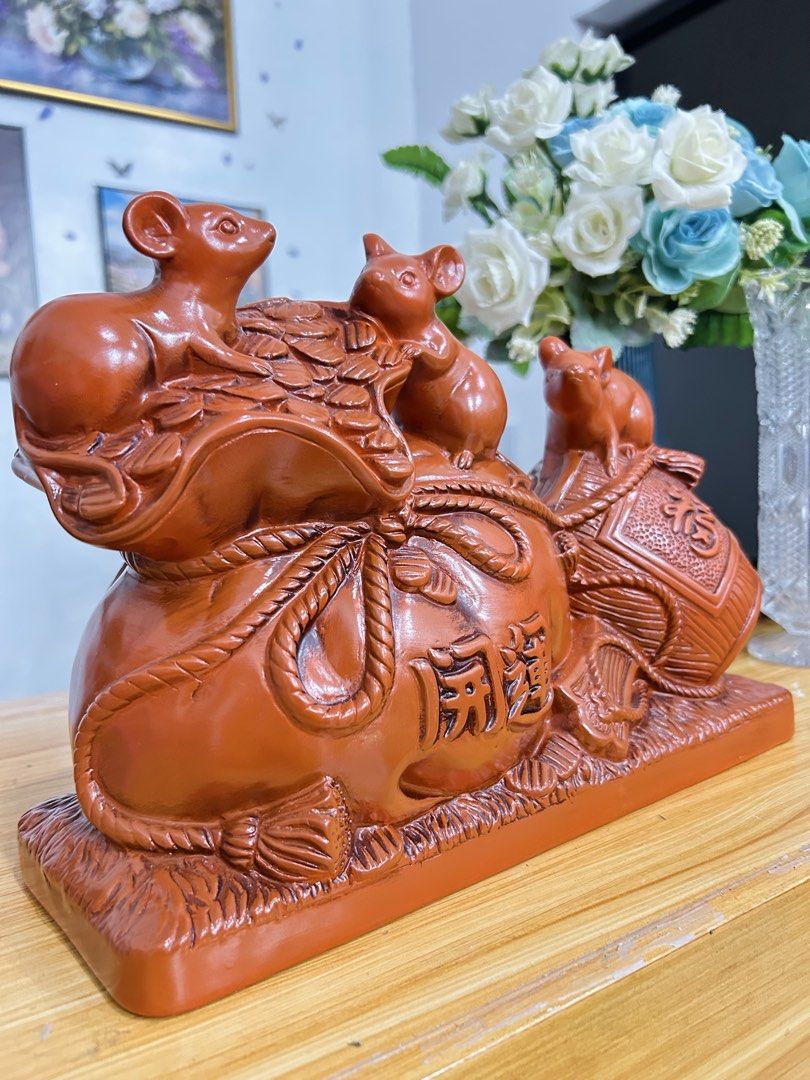 Lucky Mouse and Wealth Bag Figurine! (Category: Other Home Decor) located in Bustos. Submitted by gthings.collectibles (Listing ID 1464663104, Image 3). Description: Looking for continuous swerte and abundance para sa iyong tahanan o negosyo? Check out this beautiful, high-quality Lucky Mouse and Wealth Bag Figurine! Yours at ₱900 only!! 🌟This traditional reddish-brown piece combines the powerful symbols of prosperity from Asian tradition. Swert