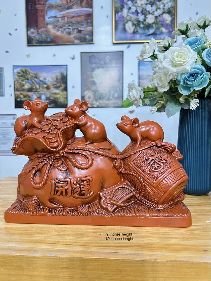 Lucky Mouse and Wealth Bag Figurine! (Category: Other Home Decor) located in Bustos. Submitted by gthings.collectibles (Listing ID 1464663104, Image 1). Description: Looking for continuous swerte and abundance para sa iyong tahanan o negosyo? Check out this beautiful, high-quality Lucky Mouse and Wealth Bag Figurine! Yours at ₱900 only!! 🌟This traditional reddish-brown piece combines the powerful symbols of prosperity from Asian tradition. Swert