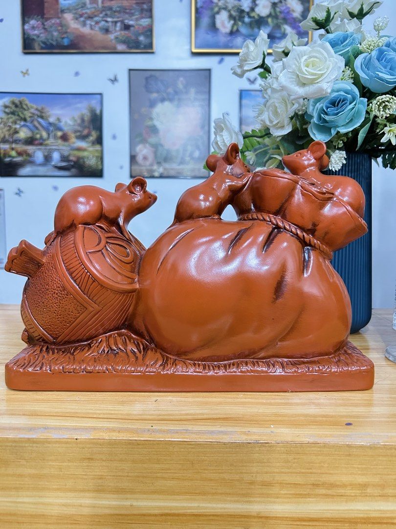 Lucky Mouse and Wealth Bag Figurine! (Category: Other Home Decor) located in Bustos. Submitted by gthings.collectibles (Listing ID 1464663104, Image 2). Description: Looking for continuous swerte and abundance para sa iyong tahanan o negosyo? Check out this beautiful, high-quality Lucky Mouse and Wealth Bag Figurine! Yours at ₱900 only!! 🌟This traditional reddish-brown piece combines the powerful symbols of prosperity from Asian tradition. Swert
