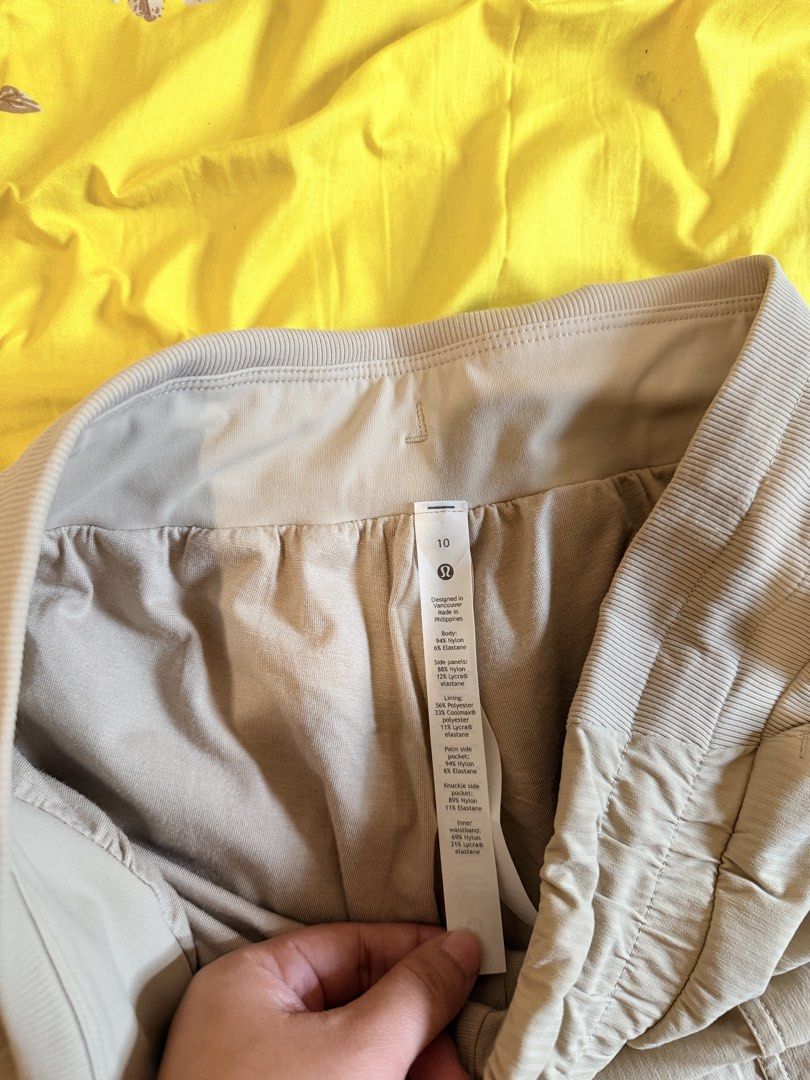 Lululemon Casual Jogger Pants Size 10 Beige (Category: Joggers) located in Malabon City. Submitted by maricris6887078 (Listing ID 1464765739, Image 2). Description: Beige Lululemon jogger pants in size 10. Drawstring waist with ribbed side panels and cuffs. Multiple utility pockets on the front. Body made from nylon and elastane blend. Comfortable fit for daily wear, workouts, or lounging around. Clean condition with clear size and material tags 