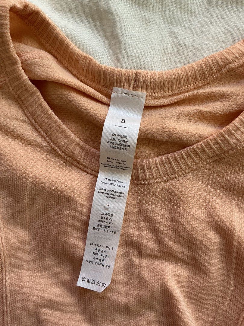Lululemon Peach Long Sleeve Running Top Size 8 (Category: Longsleeves) located in San Nicolas. Submitted by dijie.cam (Listing ID 1464639561, Image 3). Description: - Brand: Lululemon - Color: Peach - Style: Long sleeve top - Size: 8 - Features: Thumbholes on sleeves, breathable fabric - Material: 100% polyamide - Condition: Brand new with original tags - Ideal for: Runs, workouts, activewear.