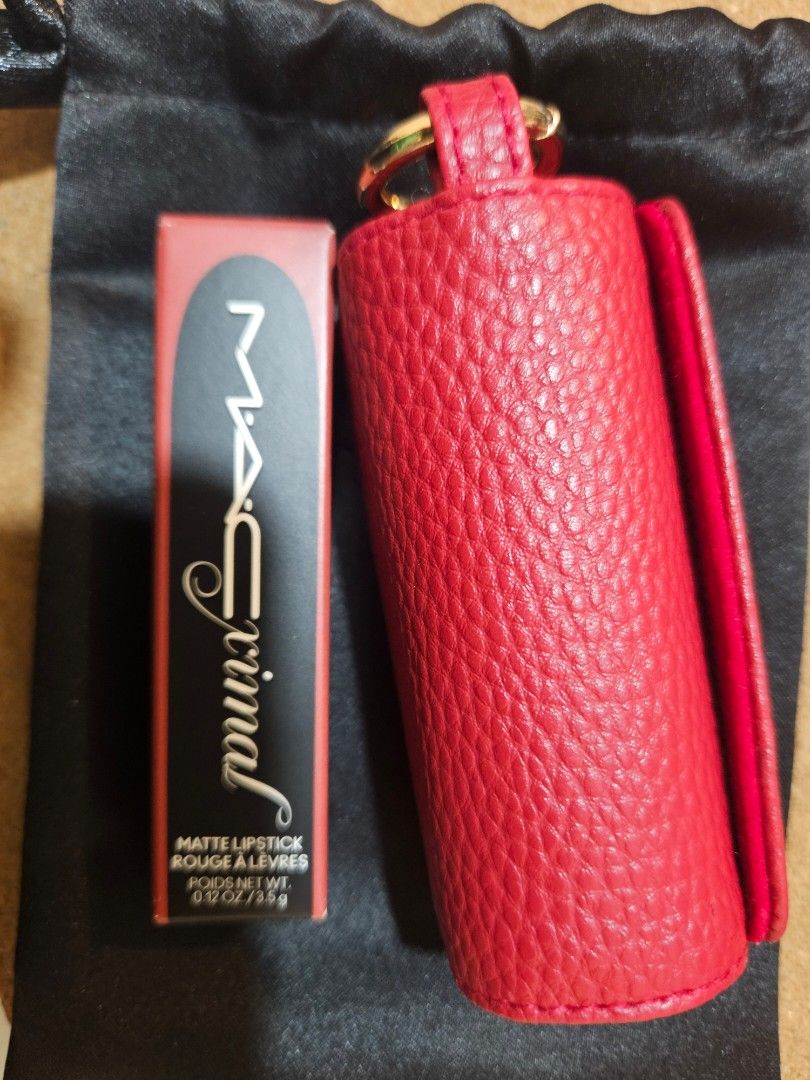 MAC Maximal Silky Matte lipstick with Red Leather Case (Category: Makeup) located in Los Banos. Submitted by acleancloset (Listing ID 1464704772, Image 2). Description: SOLD PER PIECE - Shade available: 602 Chili - Accessories: Bright red pebbled leather lipstick holder with gold hardware and a matching black pouch - Condition: Brand new, unopened, and sealed in original box.