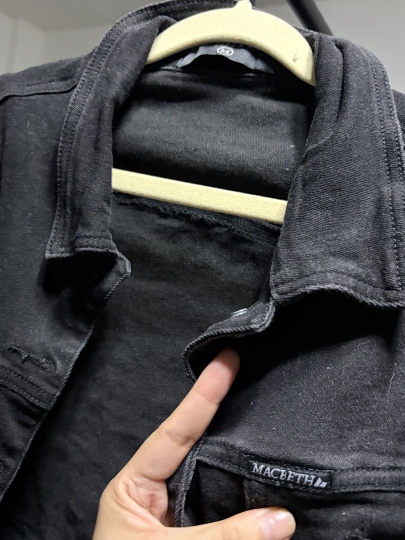 Macbeth Black Denim Jacket Size M (Category: Coats, Jackets and Outerwear) located in Manila. Submitted by finderskeepersmnl_092026 (Listing ID 1464745671, Image 3). Description: - Brand: Macbeth - Size: M - Color: Dark wash / washed black - Fit: Cropped with a stylish raw frayed hem - Details: Metal front buttons, chest pockets with branded pocket flap label - Material: Sturdy, high-quality denim - Condition: Excellent.
