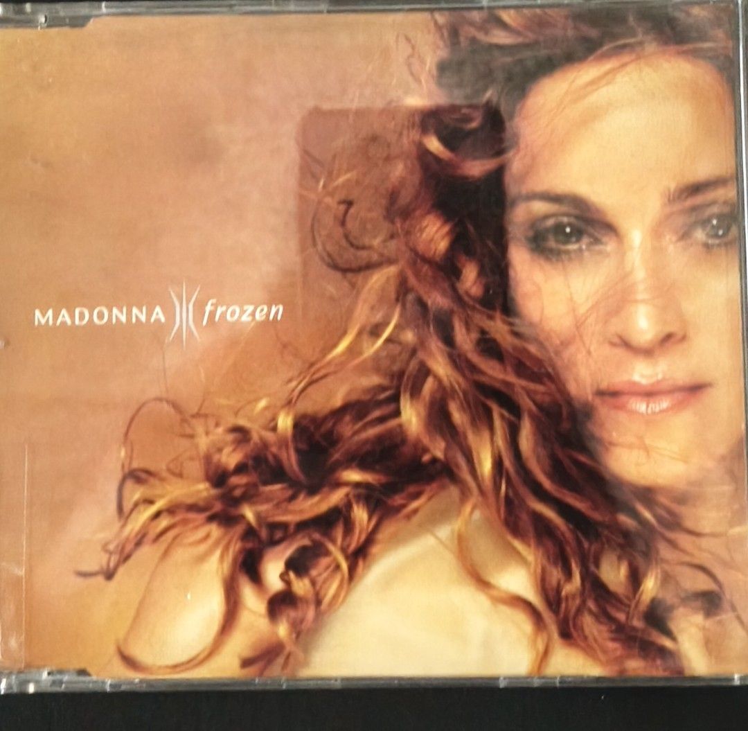 Madonna Frozen CD Single (Category: CDs & DVDs) located in Manila. Submitted by ruelcabrer77078 (Listing ID 1464748216, Image 1). Description: - Artist & Title: Madonna - Frozen Maxi CD Single - Format: Yellow disc featuring multiple remixes - Origin: Made in Germany - Catalog Number: W0433CD 9362-43990-2 - Packaging: Jewel case with cover insert included - Condition Note: Disc surface has handwritten markings in permanent marker - Perfect for Ma