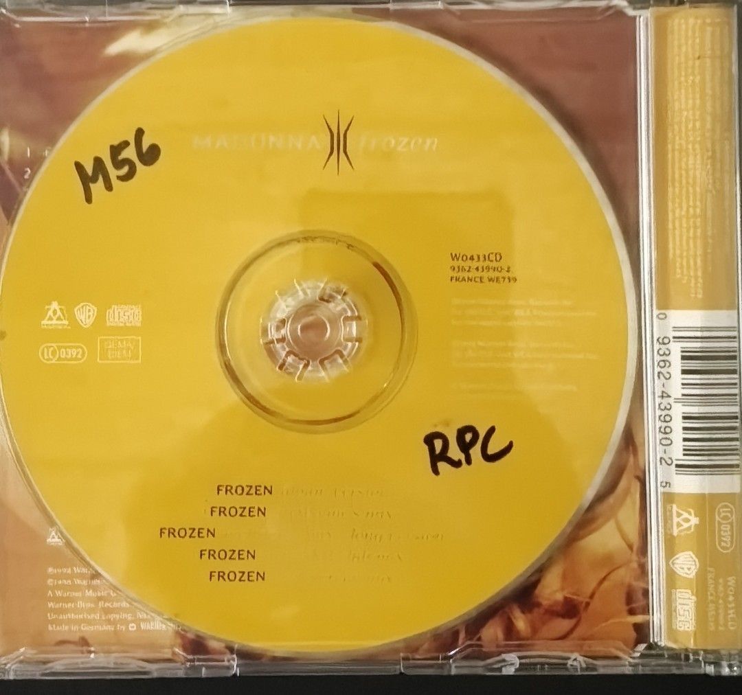 Madonna Frozen CD Single (Category: CDs & DVDs) located in Manila. Submitted by ruelcabrer77078 (Listing ID 1464748216, Image 2). Description: - Artist & Title: Madonna - Frozen Maxi CD Single - Format: Yellow disc featuring multiple remixes - Origin: Made in Germany - Catalog Number: W0433CD 9362-43990-2 - Packaging: Jewel case with cover insert included - Condition Note: Disc surface has handwritten markings in permanent marker - Perfect for Ma