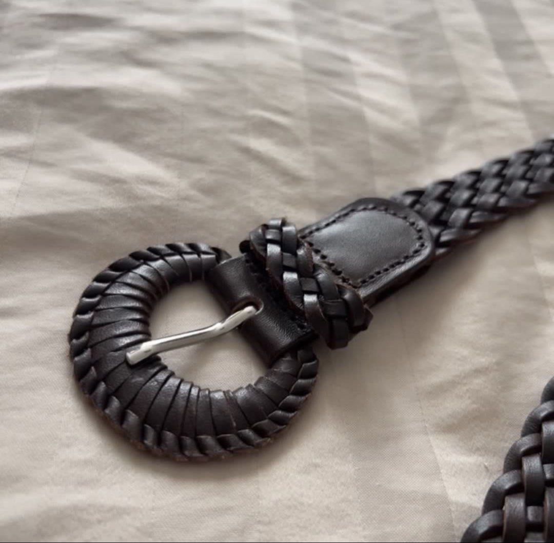 Mango Brown Woven Leather Belt with Round Buckle (Category: Belts) located in Pasig City. Submitted by jenscloset86 (Listing ID 1464573216, Image 3). Description: Brand: MANGO Size: Medium • Used TWICE. • 100% Genuine Leather • No flaws, no damages. Dimension: Width: 1” Length: 44” - Dark brown woven genuine leather belt - Unique round buckle with braided detail - Soft and flexible leather - Versatile for casual or dressy outfits .