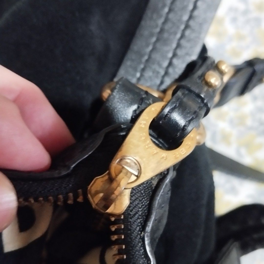 Marc by Marc Jacobs Black Suede Shoulder Bag (Category: Cross-body Bags) located in Manila. Submitted by lene48 (Listing ID 1464597477, Image 3). Description: - Authentic Marc by Marc Jacobs black suede shoulder bag - Elegant gold hardware details - Interior lining features the signature Marc Jacobs logo print - Made in Indonesia - Comes with a detachable shoulder strap for versatile styling - Ample space to carry all your daily essentials.