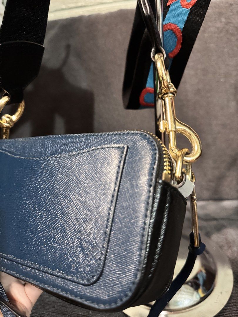 Marc Jacobs Snapshot Camera Bag Blue Gold Strap (Category: Luxury Bags & Wallets) located in Manila. Submitted by dearpinkcollections (Listing ID 1464677115, Image 3). Description: - Authentic Blue Marc Jacobs Snapshot bag - Iconic gold double J logo - Comes with a colorful strap - Convenient back pocket for quick access - Elegant gold hardware/ Navy Blue - Secure zipper closure - Ample interior space for your essentials.