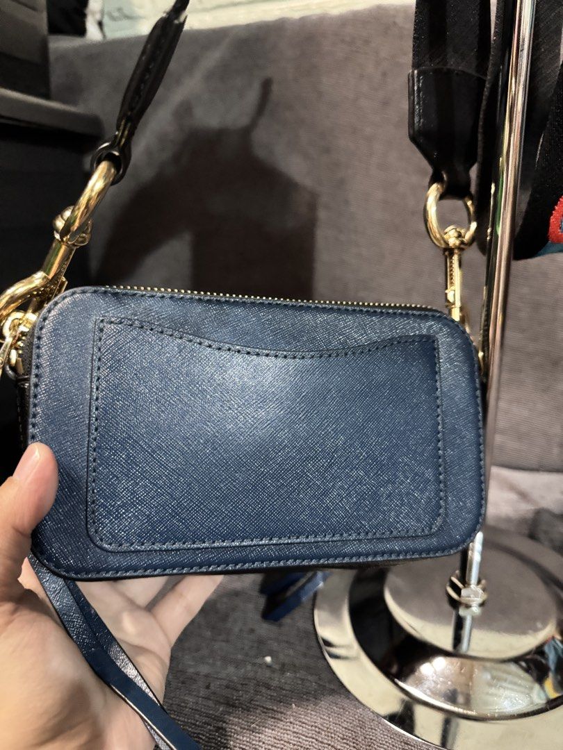 Marc Jacobs Snapshot Camera Bag Blue Gold Strap (Category: Luxury Bags & Wallets) located in Manila. Submitted by dearpinkcollections (Listing ID 1464677115, Image 2). Description: - Authentic Blue Marc Jacobs Snapshot bag - Iconic gold double J logo - Comes with a colorful strap - Convenient back pocket for quick access - Elegant gold hardware/ Navy Blue - Secure zipper closure - Ample interior space for your essentials.