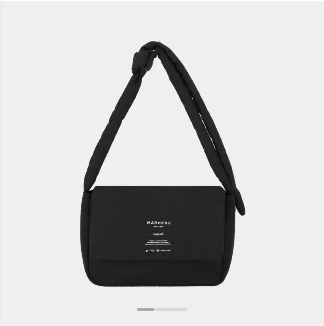 Marhen J Air Medium (Category: Cross-body Bags) located in Manila. Submitted by limtrixiem03758 (Listing ID 1464718622, Image 1). Description: - Brand: Marhen.J - Style: Black crossbody bag with a trendy padded body - Strap: Comfortable thick knotted strap - Details: White branding and text printed on the front flap - Interior: Spacious enough for your daily essentials - Versatility: Clean solid black design, very easy to match with casual outfit