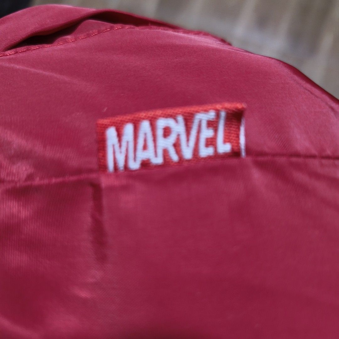 Marvel Red Jacket Official Merchandise (Category: Babies & Kids Fashion) located in Ilagan. Submitted by micassandra (Listing ID 1464695556, Image 3). Description: - Official Marvel merchandise - Bold red color with a clean fabric finish - Sturdy and durable stitching along the seams - Features a small branded red tag with white embroidered lettering on the upper chest.