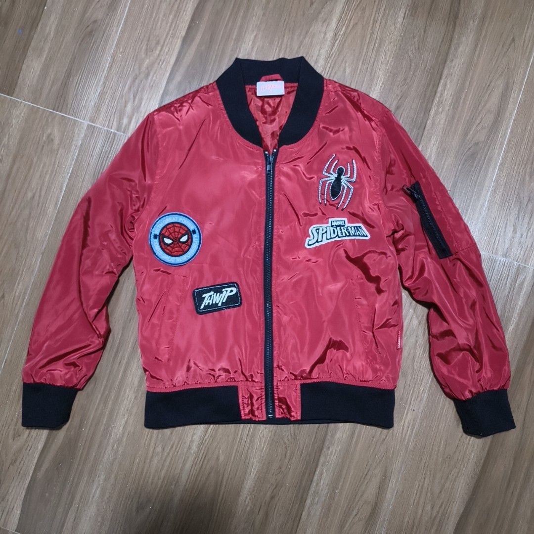 Marvel Red Jacket Official Merchandise (Category: Babies & Kids Fashion) located in Ilagan. Submitted by micassandra (Listing ID 1464695556, Image 1). Description: - Official Marvel merchandise - Bold red color with a clean fabric finish - Sturdy and durable stitching along the seams - Features a small branded red tag with white embroidered lettering on the upper chest.