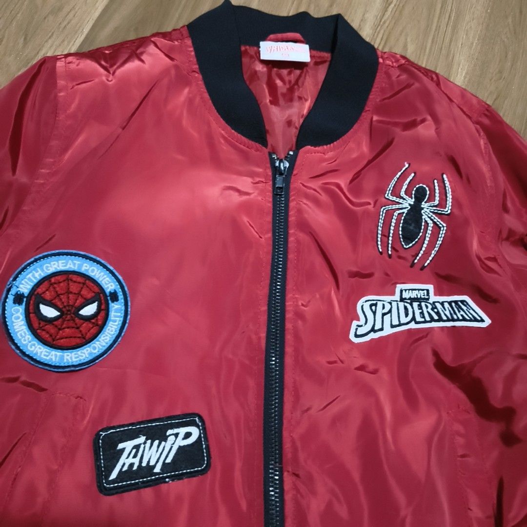 Marvel Red Jacket Official Merchandise (Category: Babies & Kids Fashion) located in Ilagan. Submitted by micassandra (Listing ID 1464695556, Image 2). Description: - Official Marvel merchandise - Bold red color with a clean fabric finish - Sturdy and durable stitching along the seams - Features a small branded red tag with white embroidered lettering on the upper chest.