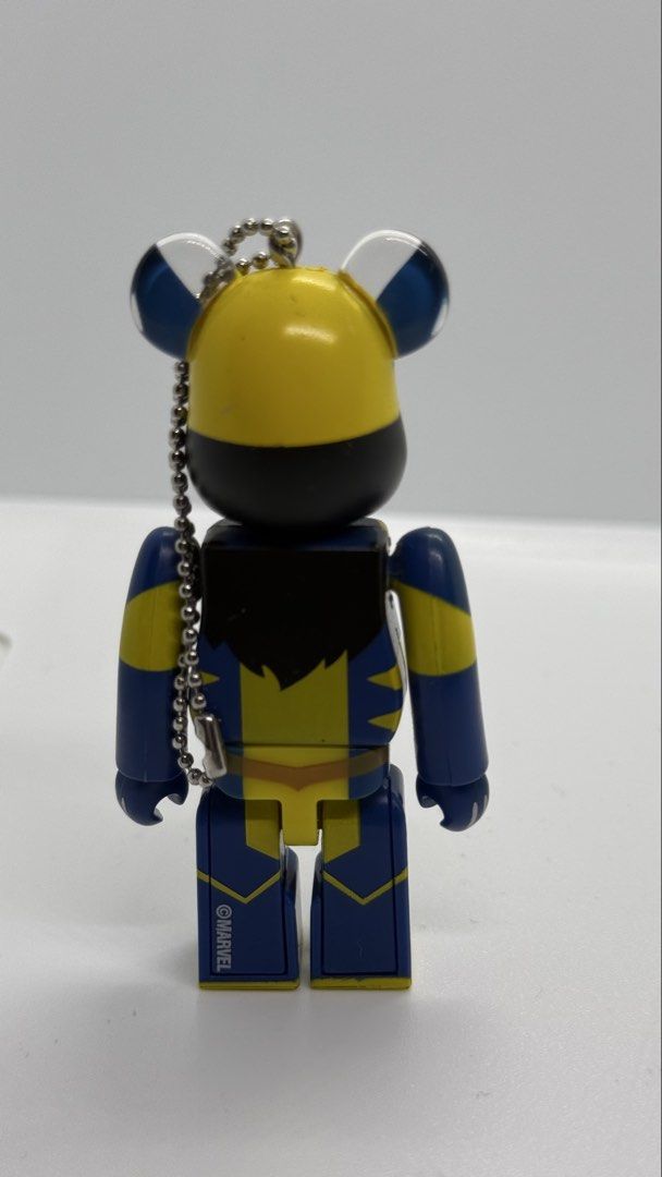 Marvel Wolverine Bearbrick Keychain Figure (Category: Designer & Blind Box Toys) located in Baguio. Submitted by zeemoda01 (Listing ID 1464712074, Image 3). Description: - Marvel Wolverine Bearbrick keychain - Iconic blue and yellow costume design with X-Men belt buckle - Detailed facial mask and painted red lips - Equipped with a ball chain at the ear for bags or keys - Features official Marvel copyright stamp on the back leg - Perfect collectib
