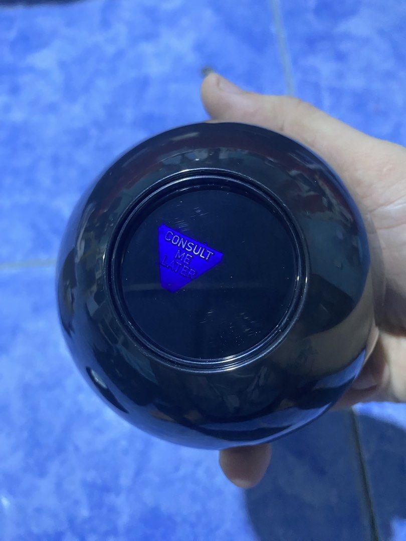 Mattel Magic 8 Ball Fortune Teller Toy (Category: Interactive Toys) located in Manila. Submitted by secretjoy.609 (Listing ID 1464746153, Image 2). Description: - Classic black Magic 8 Ball toy with a bold number 8 on the front - Interactive fortune teller: turn it over to reveal answers through the bottom window - Displays the phrase 'Consult me later' on a blue triangle - Perfect as a fun desk toy, conversation starter, or party game - Great no