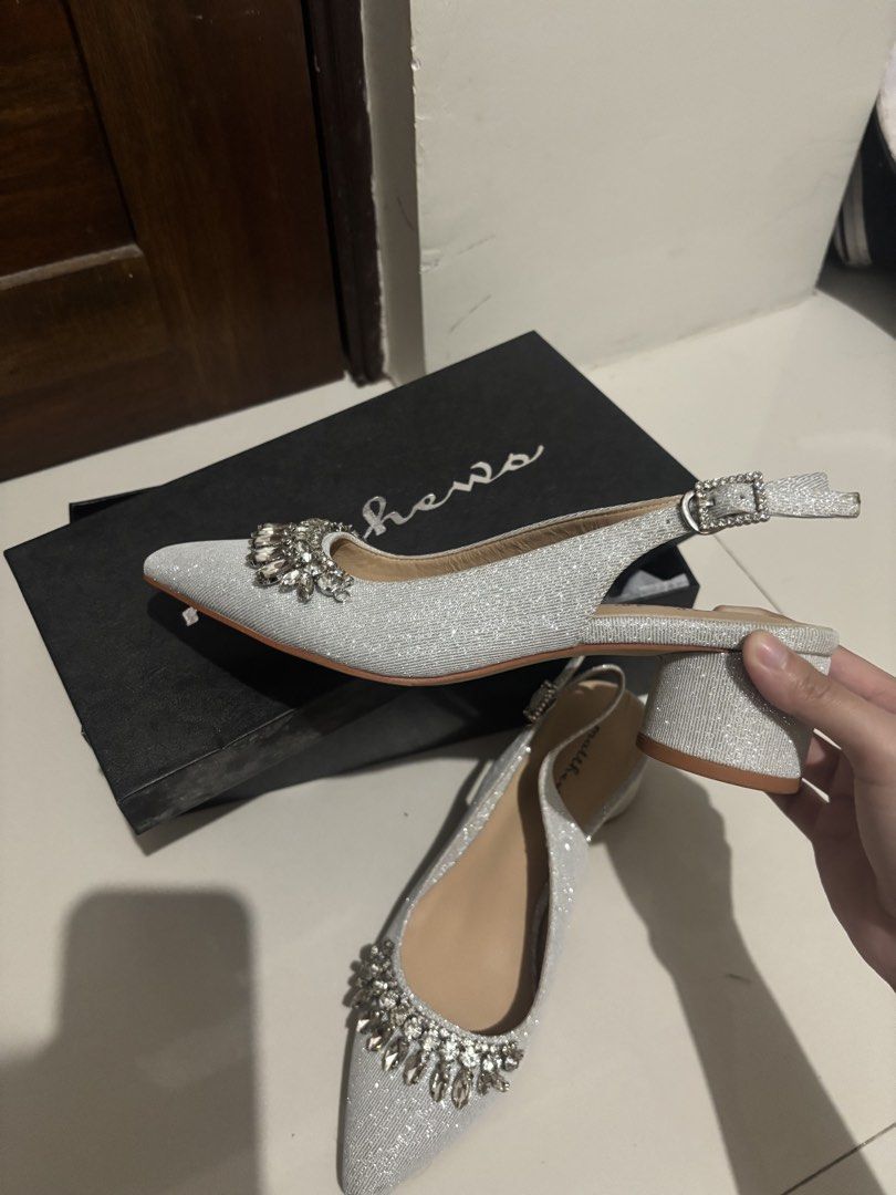 Matthews Closed Toe Heels 2-Inch Silver Size 36 (Category: Heels) located in Manila. Submitted by aysshxx (Listing ID 1464688817, Image 3). Description: - Brand: Matthews - Style: Silver glitter slingback heels with pointed toe - Details: Decorated with chunky rhinestones and crystals, adjustable back strap - Heel: Mid block heel (very manageable height) - Condition: Worn once or twice, minimal wear on soles - Packaging: Comes in original black M
