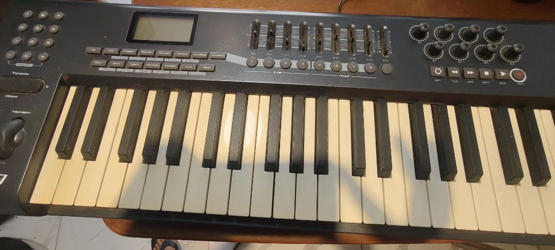 M-Audio Axiom 61 MIDI Keyboard Controller (Category: Musical Instruments) located in Bulacan. Submitted by babz30261 (Listing ID 1464713575, Image 3). Description: - Model: M-Audio Axiom 61 semi-weighted keyboard - 61 keys with pitch bend and modulation wheels - Packed with multiple sliders, rotary encoder knobs, and transport control buttons - Equipped with responsive drum pads and a clear LCD screen - Standard USB MIDI controller setup, perfect