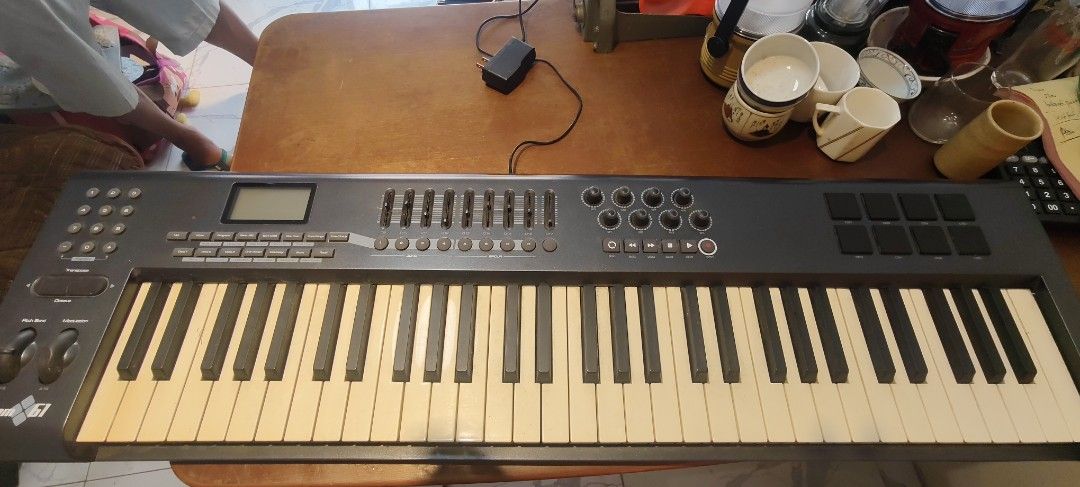 M-Audio Axiom 61 MIDI Keyboard Controller (Category: Musical Instruments) located in Bulacan. Submitted by babz30261 (Listing ID 1464713575, Image 2). Description: - Model: M-Audio Axiom 61 semi-weighted keyboard - 61 keys with pitch bend and modulation wheels - Packed with multiple sliders, rotary encoder knobs, and transport control buttons - Equipped with responsive drum pads and a clear LCD screen - Standard USB MIDI controller setup, perfect