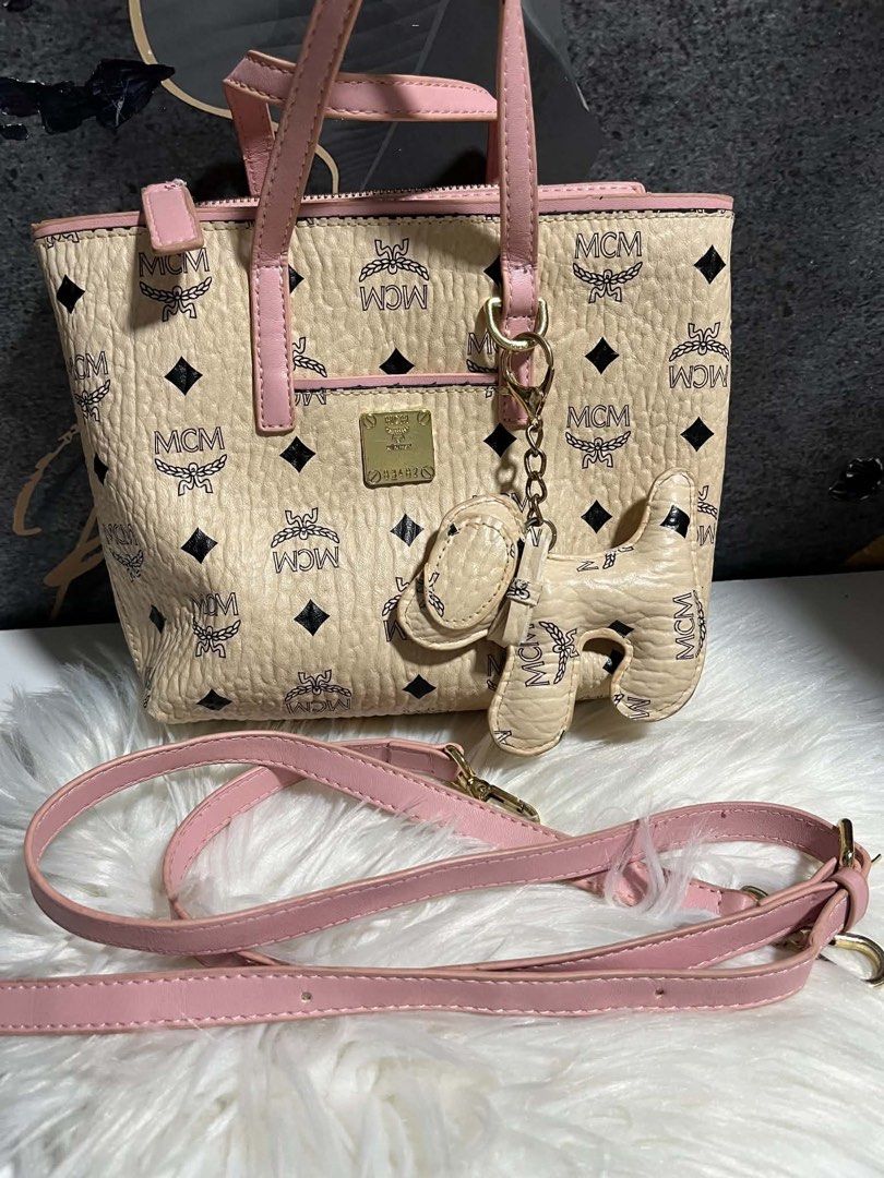 Mcm pink/cream sling bag (Category: Luxury Bags & Wallets) located in Caloocan City. Submitted by trebdy01 (Listing ID 1464655947, Image 1). Description: .
