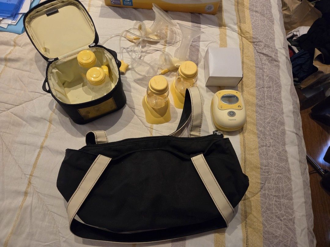 Medela Freestyle Double Electric Breast Pump Set (Category: Breastfeeding & Bottle Feeding) located in Taytay. Submitted by boymomof3 (Listing ID 1464766195, Image 3). Description: - Complete Medela Freestyle double electric breast pump set (hospital grade) - Includes main pump unit with digital screen and power adapter - Comes with tubing, breast shields, and 4 collection/storage bottles with stands and lids - Includes branded cooler bag with ic